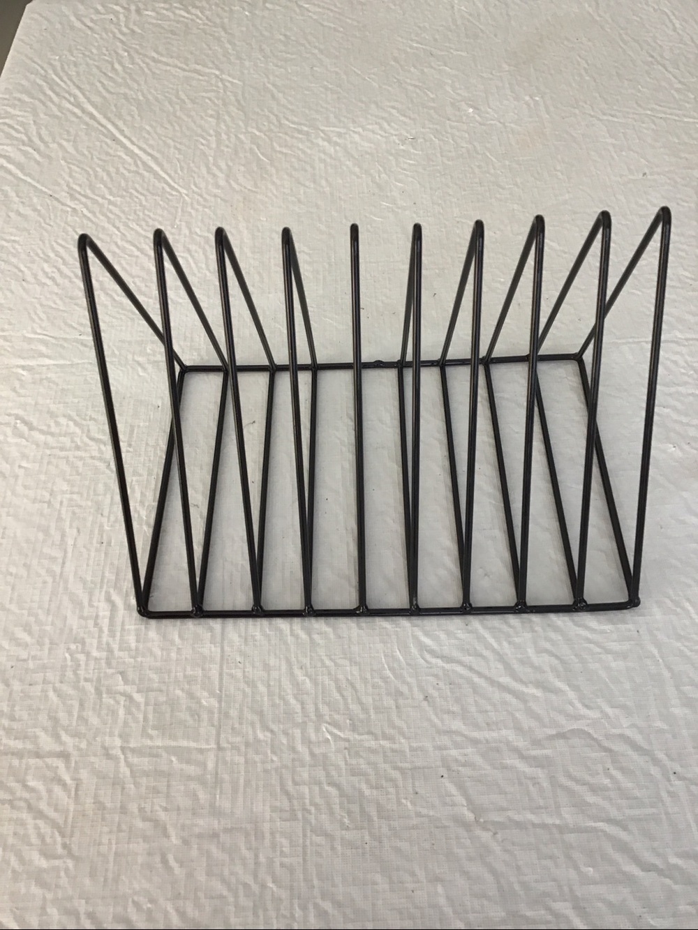 One black metal desktop magazine storage racks. ##